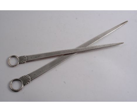 A GRADUATED PAIR OF GEORGE III SCOTTISH MEAT SKEWERS with shell & ring terminals, feint traces of an initial, by P. Cunningha