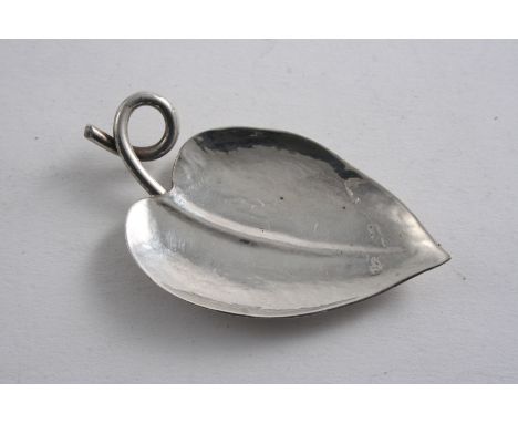A HANDMADE LEAF-SHAPED CADDY SPOON with a coiled wire handle by the Guild of Handicrafts (Chipping Campden), London 1958;  2.