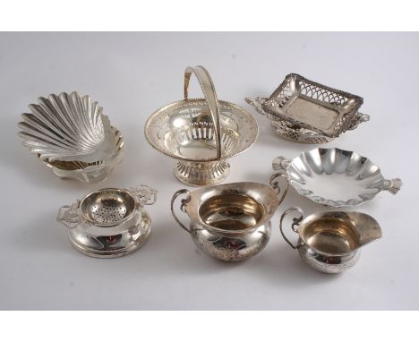 A MIXED LOT: A modern tea strainer & stand, two butter shells (one initialled), a small two-handled dish, three bonbon dishes