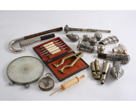 A MIXED LOT: A turned ivory medical syringe, a brass, two-tone whistle, a nickel two-tone whistle, a set of watchmaker's stee