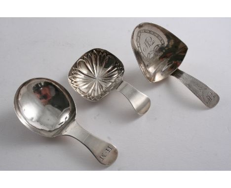 A GEORGE III CADDY SPOON with a "scoop" bowl & pricked engraving, initialled, by Thomas Wilmore, Birmingham 1800 and two othe