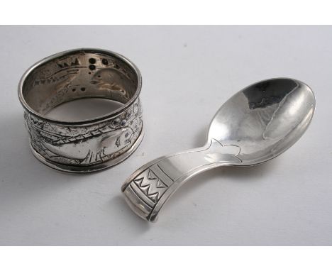 A MODERN CADDY SPOON with incised linear decoration, maker's mark "RWB", Birmingham 1921, and a plated napkin ring by the Kes