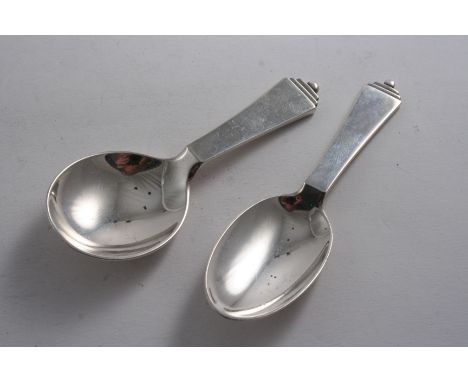 BY GEORG JENSEN: A Danish Pyramid pattern caddy spoon with a round bowl & import marks for London 1930, and another with an o