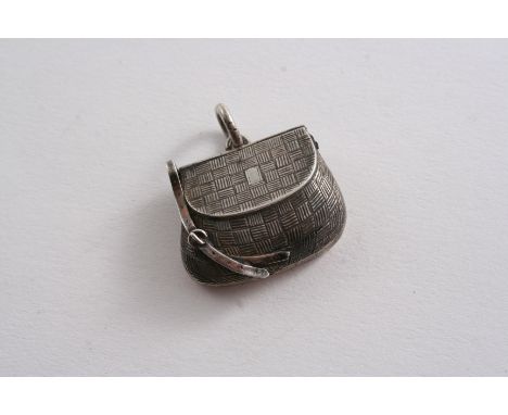 A SMALL VICTORIAN NOVELTY LOCKET in the form of a fishing creel, hinging open to take two images (behind glass), maker's mark