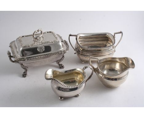 A GEORGE III MILK JUG on button feet, crested by R. Emes & E. Barnard, London 1816, a George III circular cream jug, crested,