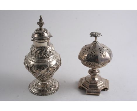 A GEORGE III EMBOSSED TEA CADDY with a baluster body & domed circular foot, the cover with a large finial (& later-added hing