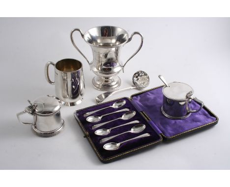 A MIXED LOT: A cased set of six coffee spoons, a George IV Fiddle sifter ladle, initialled, a mug, initialled, a two-handled 