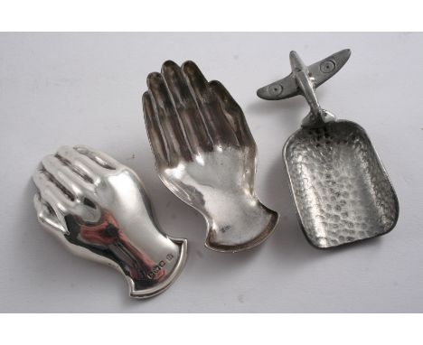 A MODERN "HAND" CADDY SPOON by Thomas Bradbury & Sons, Sheffield 1933 together with a plated match and a pewter caddy spoon w