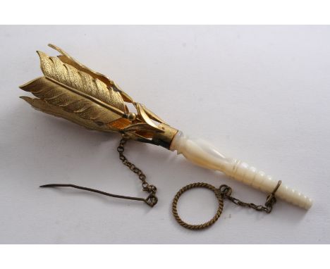 A MID 19TH CENTURY GILT-METAL POSY HOLDER with a turned mother of pearl handle & stylised arrows around the top, finger ring,