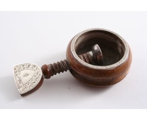 A LATE VICTORIAN MOUNTED HARDWOOD NUT CRACKER with a circular body & screw action, monogrammed, by R. Martin & E. Hall, Sheff