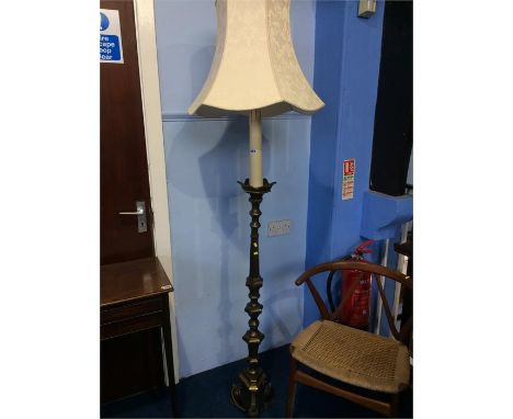 A heavy brass standard lamp