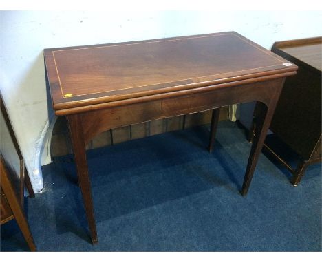 A 19th century mahogany rectangular top fold over card table