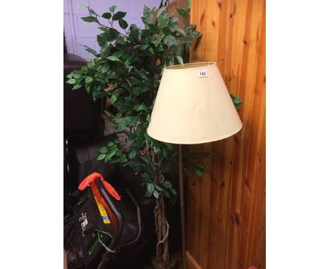 An artificial tree and a lamp