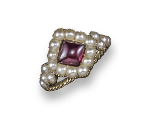 A George III garnet and pearl ring, set in gold with ropetwist shank, inscription to interior for 1819, size P 1/2