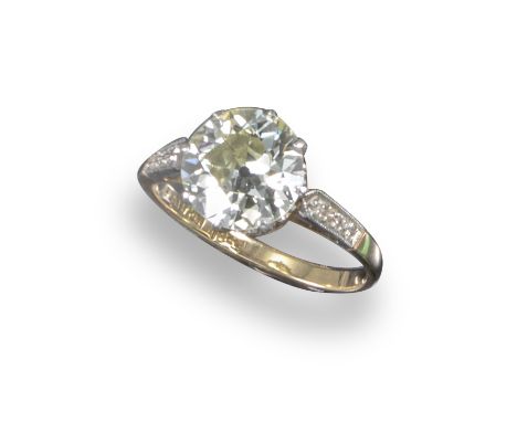 A diamond solitaire ring, the old circular-cut diamond weighs approximately 1.70cts, with millegrain-set diamond shoulders in