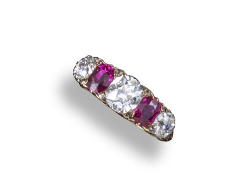 A Victorian ruby and diamond half-hoop ring, set with two oval-shaped rubies and three graduated old circular-cut diamonds in