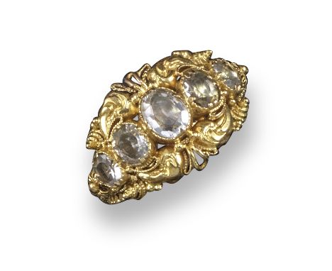 A Regency aquamarine five-stone ring, set within elaborate gold scroll mount and ropetwist shank, with inscription to the int