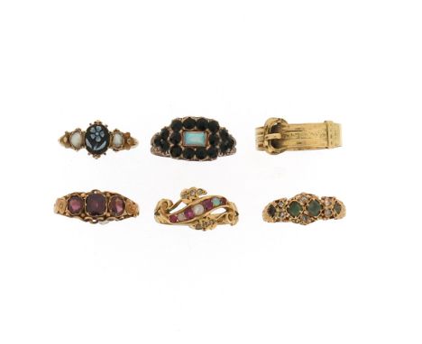 Six antique gem-set gold rings, including an Edwardian 18ct gold ring, of scroll form and alternately-set with four graduated