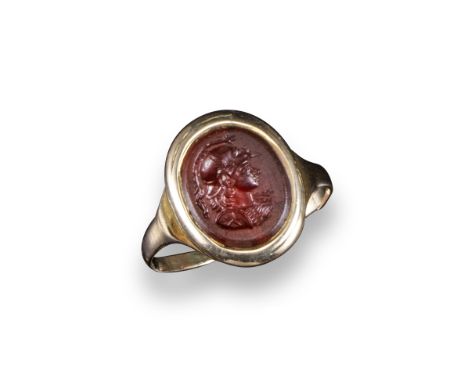 An antique carved oval agate intaglio depicting Perseus, 1.3cm high, mounted in a broken gold ring, size R approx.