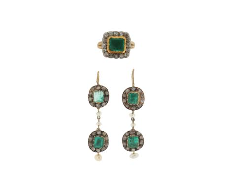 A pair of antique emerald and diamond drop earrings, formed from two clusters and separated with seed pearls in silver and go