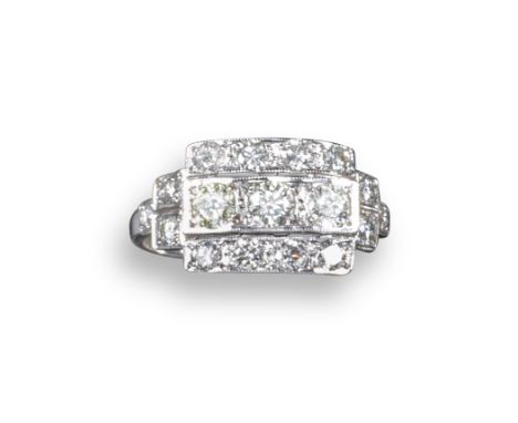 A diamond cluster ring, the rectangular centre section is set with three rows of graduated circular-cut diamonds, with furthe