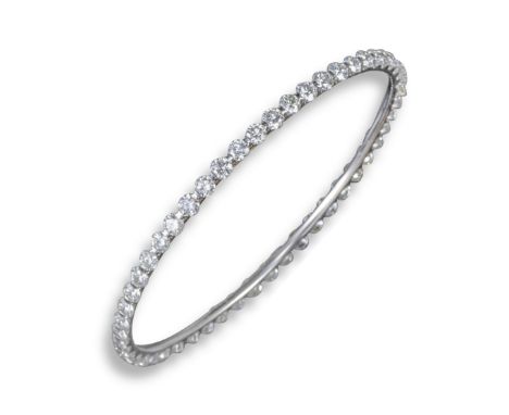 A diamond-set full circle white gold bangle, set with fifty-two round brilliant-cut diamonds, internal diameter 7cm