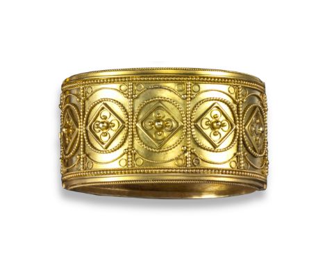 An Etruscan Revival gold bangle, with ropetwist and pellet decorated in yellow gold, 3.2cm wide, 5.3cm inner diameter, case