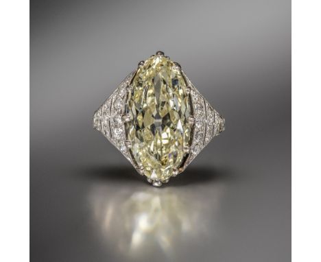 An Art Deco diamond ring, set with an old-cut marquise-shaped diamond weighing approximately 4.80cts within graduated shoulde