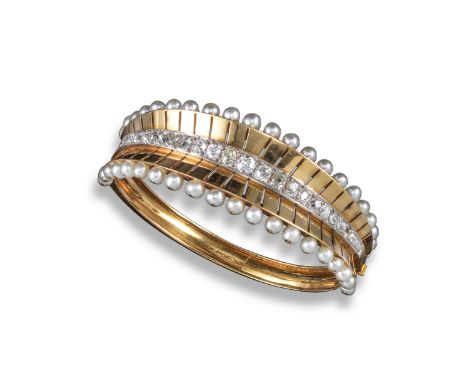 A French pearl and diamond bangle, set with a central line of graduated old cushion-shaped diamonds within fluted gold border