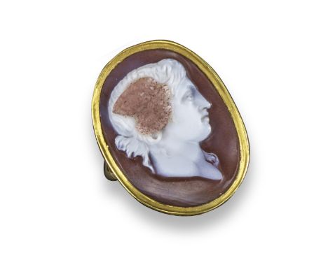 A carved three-colour agate cameo depicting the profile of Hypnos, hair tied back, with wings and portrayed with his eyes ope