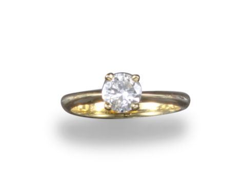 A diamond solitaire ring, the round brilliant-cut diamond weighs approximately 0.75cts, set in yellow gold, size M