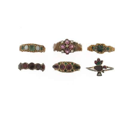 Six 19th century gem-set rings, including a 19th century 12ct gold ring, centred with a cluster of four garnets and seed pear