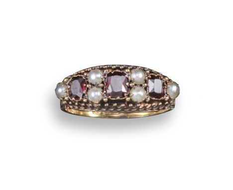 A 19th century garnet and pearl ring, set in 15ct yellow gold scroll mount, Birmingham hallmarks for 1882, size P 1/2