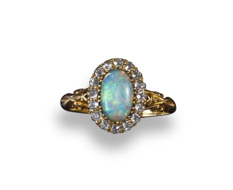 A Victorian opal and diamond cluster ring, the oval opal cabochon is set within a surround of small old circular-cut diamonds
