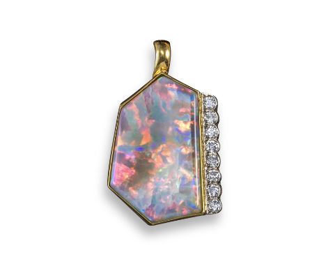 An abstract opal and diamond pendant, the solid white opal of hexagonal form set with a line of circular-cut diamonds in plat