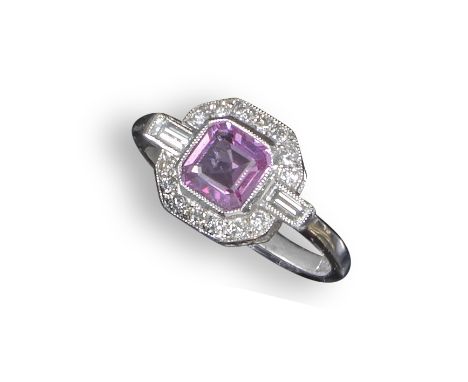A pink sapphire and diamond ring, the square-shaped pink sapphire is set within a surround of small circular-cut diamonds and