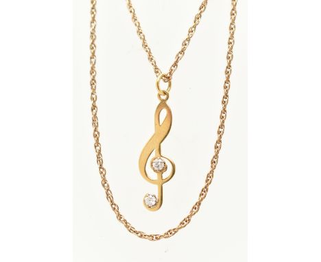 A YELLOW METAL DIAMOND SET PENDANT WITH CHAIN, the pendant in the form of a double clef set with two small round brilliant cu