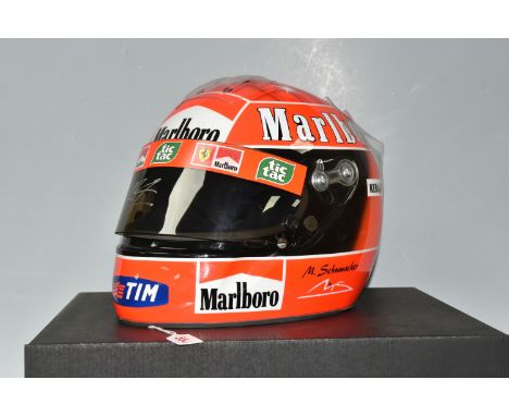 A 2006 MICHAEL SCHUMACHER REPLICA HELMET, bears a signature, with an F1 Authentics box, missing certificate (1 + box) (Condit