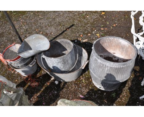 A COLLECTION OF VINTAGE GALVANISED BUCKETS AND TUBS including a dolly tub (bottom rusted through) a tin bath, a grocers scoop