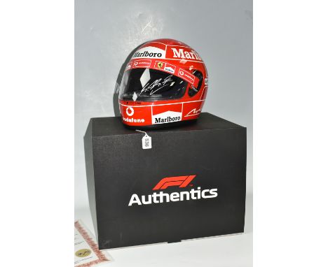 A BOXED 2006 MICHAEL SCHUMACHER FORMULA ONE SIGNED REPLICA HELMET, limited edition with box, bears a signature in silver acro