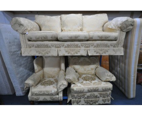 A GOLD FOLIATE UPHOLSTERED THREE PIECE LOUNGE SUITE, comprising a three seater sofa, length 225cm x depth 100cm x height 95cm