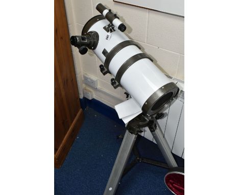 A SHORT TUBE NEWTONIAN EQUATORIAL REFLECTOR TELESCOPE with instruction manual, model 1400150  mounted on tripod, focal length