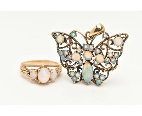AN OPAL RING AND PENDANT, the first a three stone opal ring, set in a yellow metal raised mount with an open work heart galle