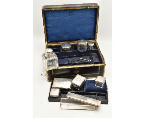 A 19TH CENTURY WOODEN AND BRASS TRAVEL SET, brass hard wear with twin hidden brass handles, engraved monogram to the lid, loc