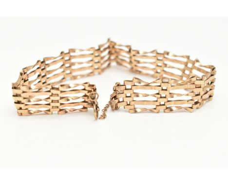 A 9CT GOLD GATE BRACELET, AF missing clasp, five bar gate bracelet, with safety chain, length 180mm, approximate gross weight