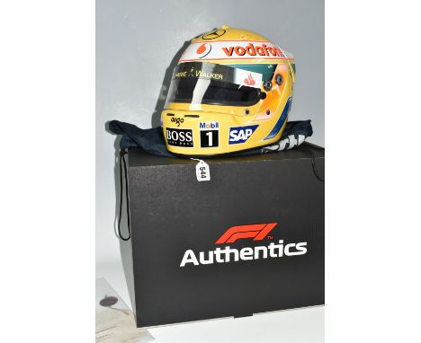 A 2008 'LEWIS HAMILTON' REPLICA HELMET, bearing a signature with a dust bag, F1 Authentics box and an 'Autographs of the Worl