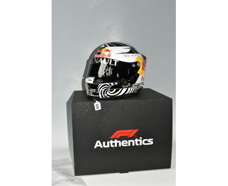 A BOXED 2006&nbsp; SEBASTIAN VETTEL RENAULT FULL SIZE REPLICA HELMET, with a box, bears a signature in silver across the viso