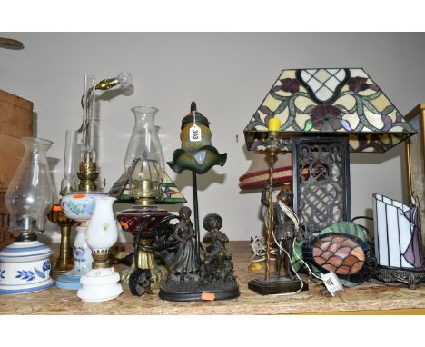A GROUP OF OIL AND TABLE LAMPS, comprising five Tiffany style table lamps with leaded glass shades and five assorted oil lamp