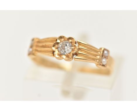 A LATE VICTORIAN YELLOW METAL DIAMOND AND SPLIT PEARL RING, set with a central old cut diamond, estimated diamond weight 0.10