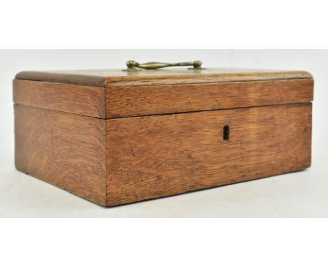 A small mid 19th century Victorian oak tea caddy box. The tea caddy with brass ring handle to top, opening to reveal twin com